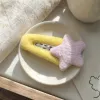 A cute girlish headwear decorated with yellow plush hair clips and pink stars details Picture